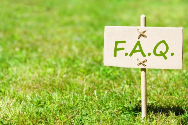 FAQ sign on stick planted on grass