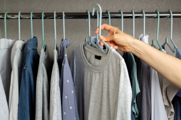 man choosing the right clothing for summer