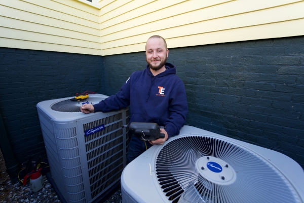 Taylor Energy professional technician making sure a client has well-matched HVAC systems