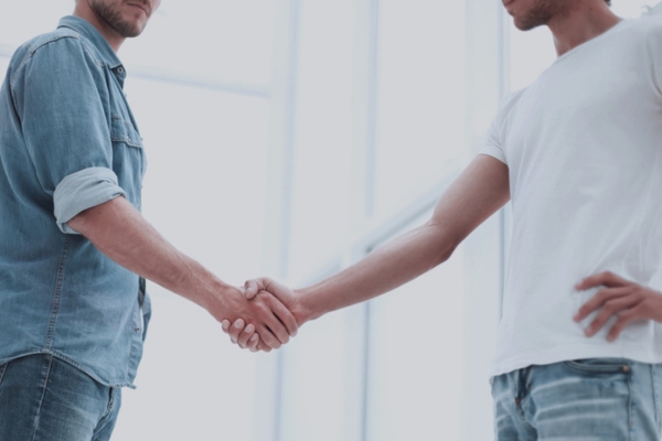 two men shaking hands depicting air conditioning consultation