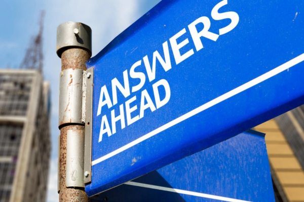 answers ahead written on street sign depicting questions about furnace and boilers