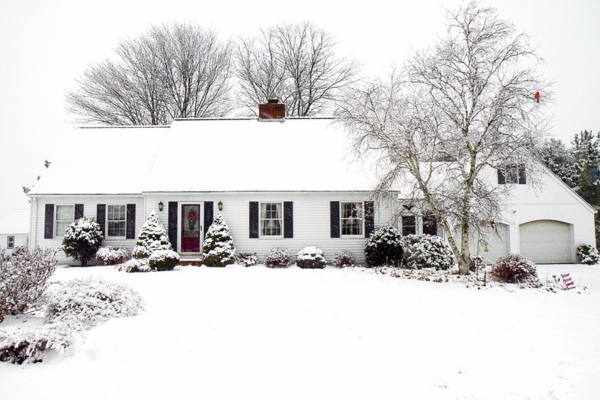 house and front yard after snow during winter