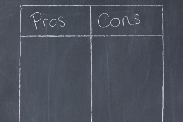 pros and cons table drawn on a chalkboard depicting boiler