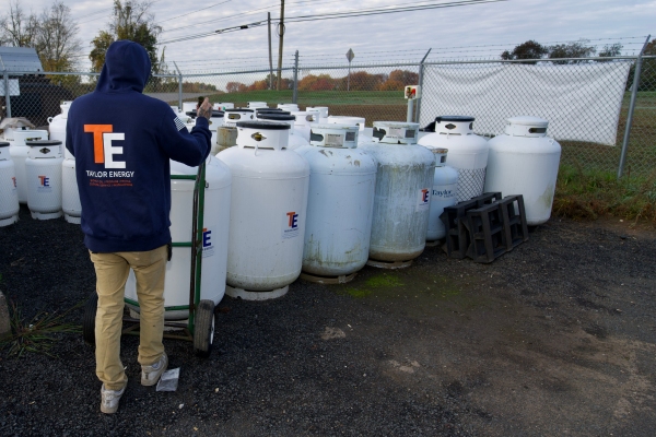 Taylor Energy staff and propane tanks